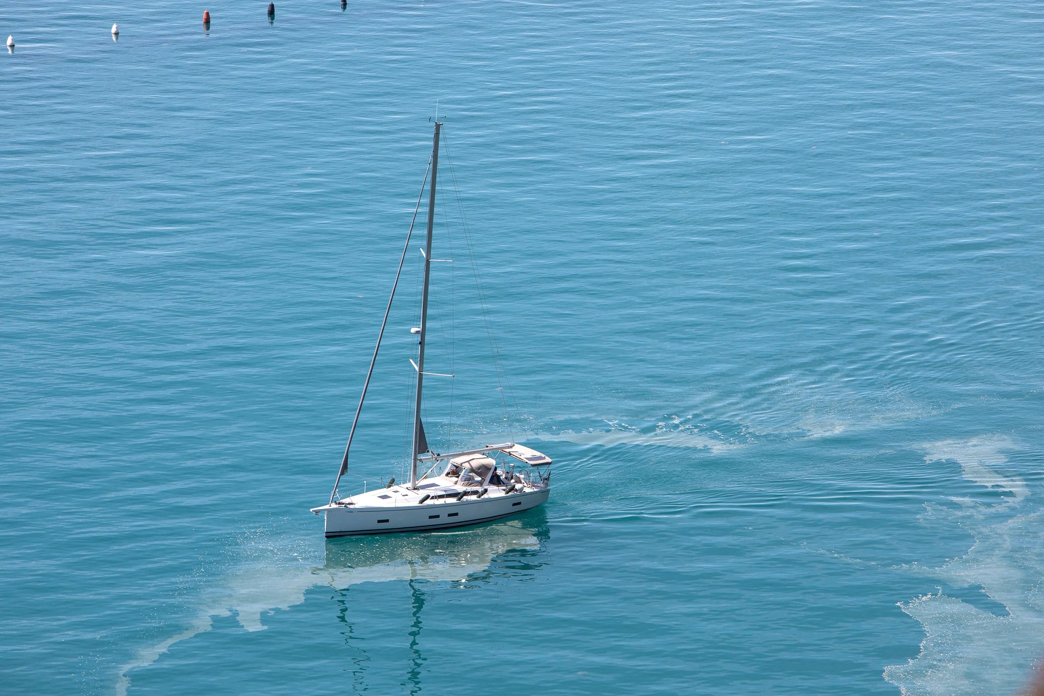 30-foot sailboat underway on open water